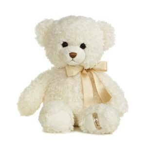 A white teddy bear with a bow on its neck.