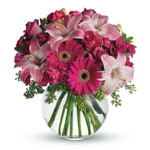 A vase filled with pink flowers and green stems.