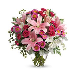 A bouquet of pink flowers in a vase.