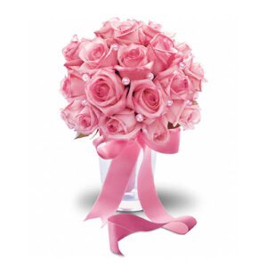 A bouquet of pink roses in a vase with a pink ribbon.