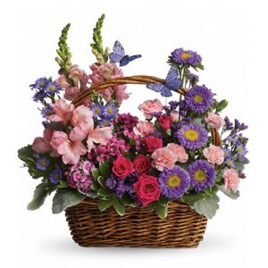 A basket of flowers with purple and pink flowers.