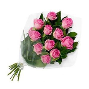 A bouquet of pink roses wrapped in plastic.