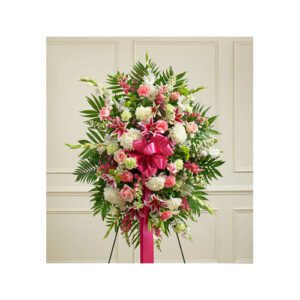 A pink and white floral arrangement on display.