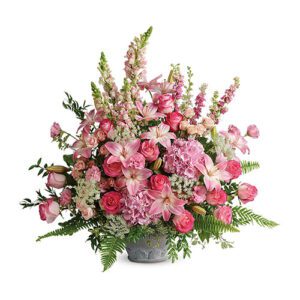 A bouquet of pink flowers in a metal container.