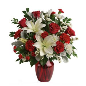 A bouquet of flowers in a red vase.