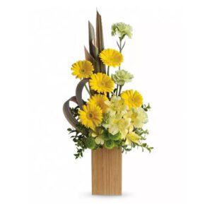 A bouquet of yellow flowers and some scissors