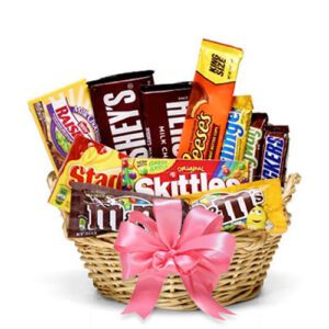A basket of candy is shown with pink ribbon.