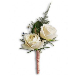 A white rose boutonniere with greenery.