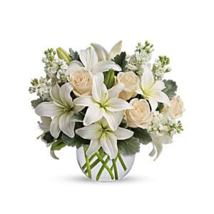 A bouquet of white flowers in a vase.