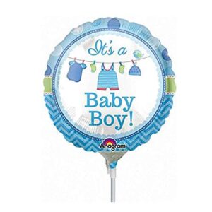 A baby boy balloon with clothes hanging on the line.