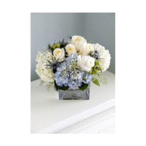 A bouquet of flowers in a vase on top of a table.