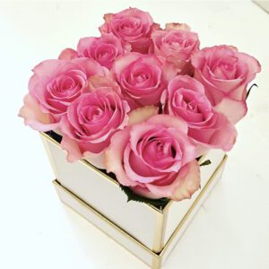 A square box with pink roses in it