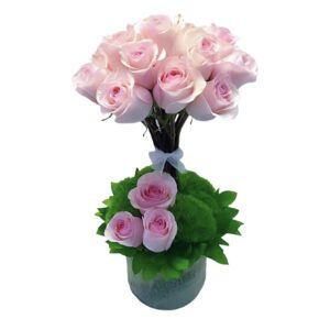 A bouquet of pink roses in a vase.