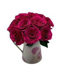 A vase of roses is shown in this image.