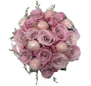 A bouquet of pink roses and greenery.