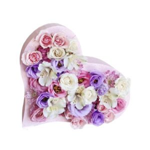 A heart shaped box filled with flowers.