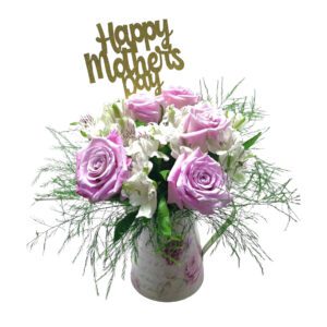 A vase of flowers with the words happy mother 's day on it.