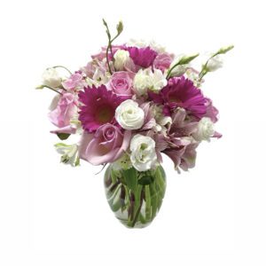 A bouquet of flowers in a vase on a table.