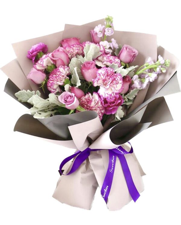 A bouquet of pink flowers wrapped in paper.