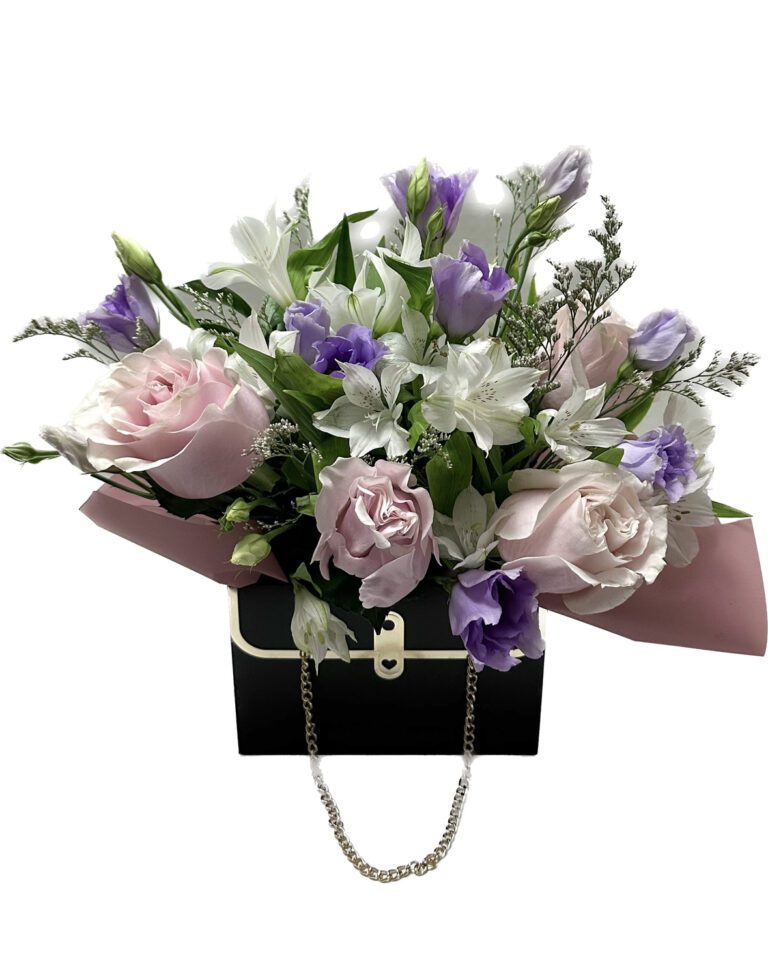 A bouquet of flowers in a black purse.