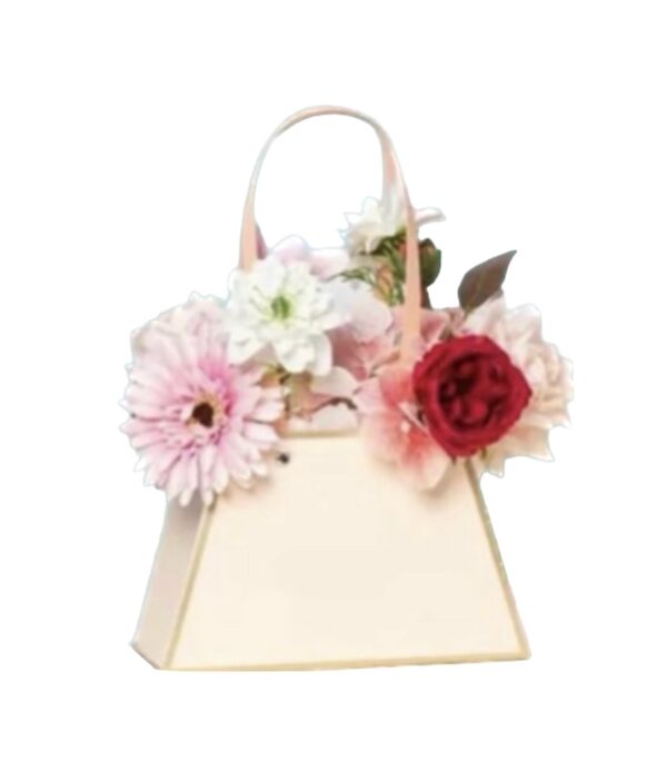 A white purse with flowers on it.