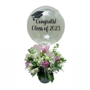 A balloon with flowers in it that says " congrats class of 2 0 2 3 ".