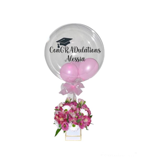 A balloon with the name of graduation and flowers.