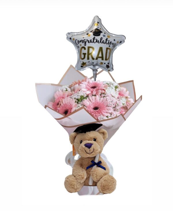 A teddy bear with flowers and balloon for graduation