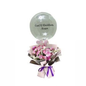 A bouquet of flowers in a balloon with a message.