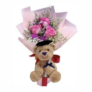 A teddy bear with roses in it