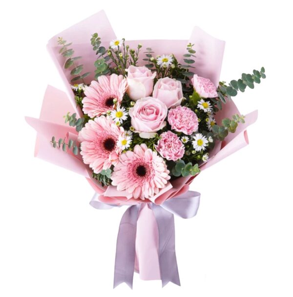 A bouquet of pink flowers wrapped in paper.